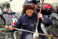 A blind musician outside the President's Palace